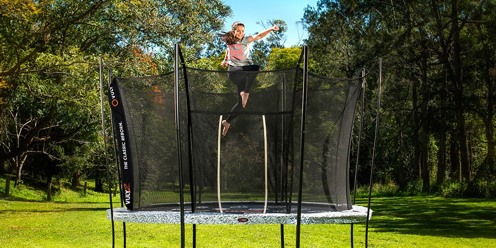 Girl bouncing on a Vuly trampoline while shadow boxing