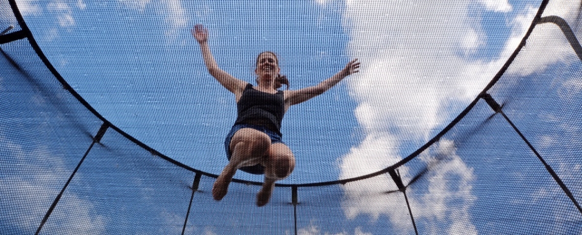 Women bouncing on a trampoline ready for exercise