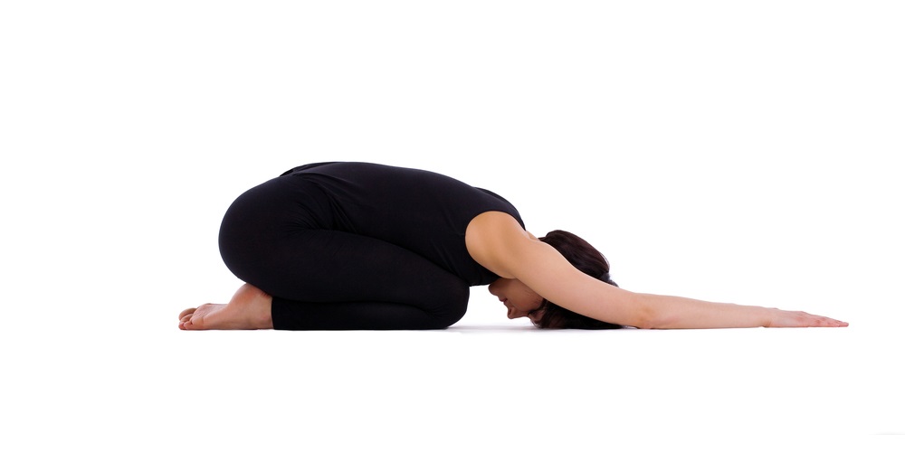 Woman in the child pose yoga position