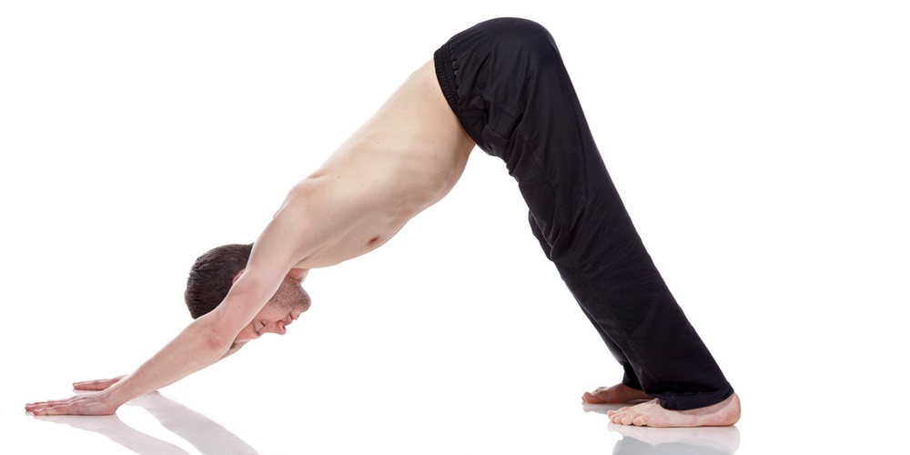 Woman in downward dog pose position